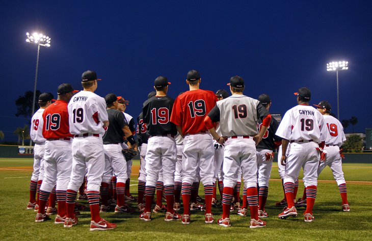SDSU baseball players wore Tony Gwynn's jerseys for the national anthem prior to their home opener against Washington on Friday, Feb. 17, 2012. Gwynn, the coach of the Aztecs is in the hospital recovering from surgery after removing a tumor in his cheek. — K.C. Alfred, UT San Diego